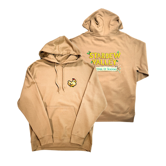 Two beige hooded sweatshirts featuring Stardew Valley game graphics.
