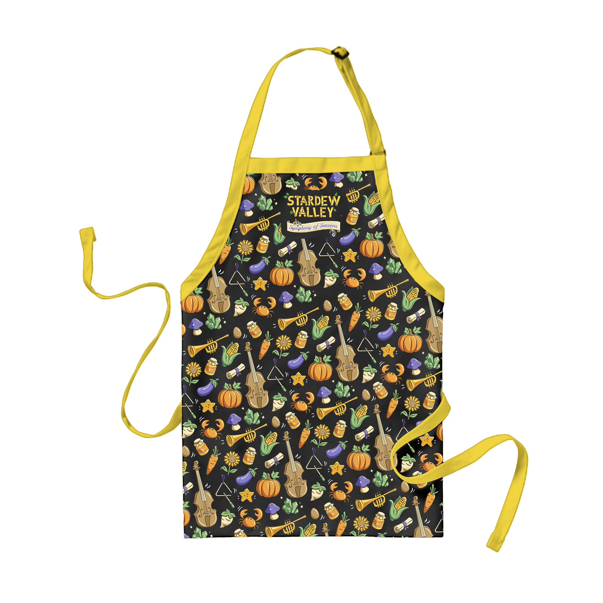 A black apron with yellow straps and ties, featuring a playful pattern of violins, trumpets, pumpkins, carrots, mushrooms, and stars in warm tones.