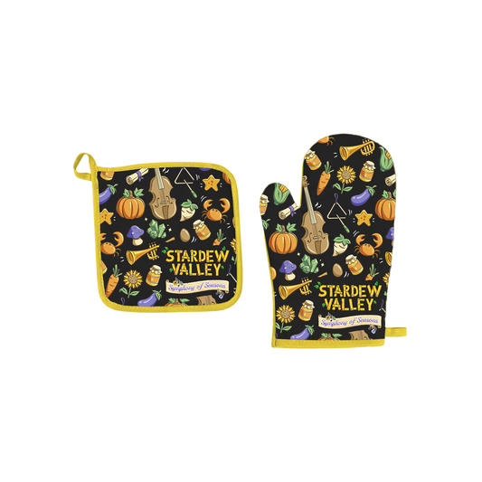 Black oven mitt and pot holder set with yellow trim, featuring a playful ’stardew valley’ design of musical instruments, vegetables, and autumn motifs.