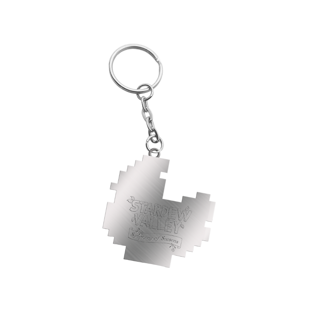 Silver metallic keychain shaped like a pixelated map of stardew valley with engraved text.