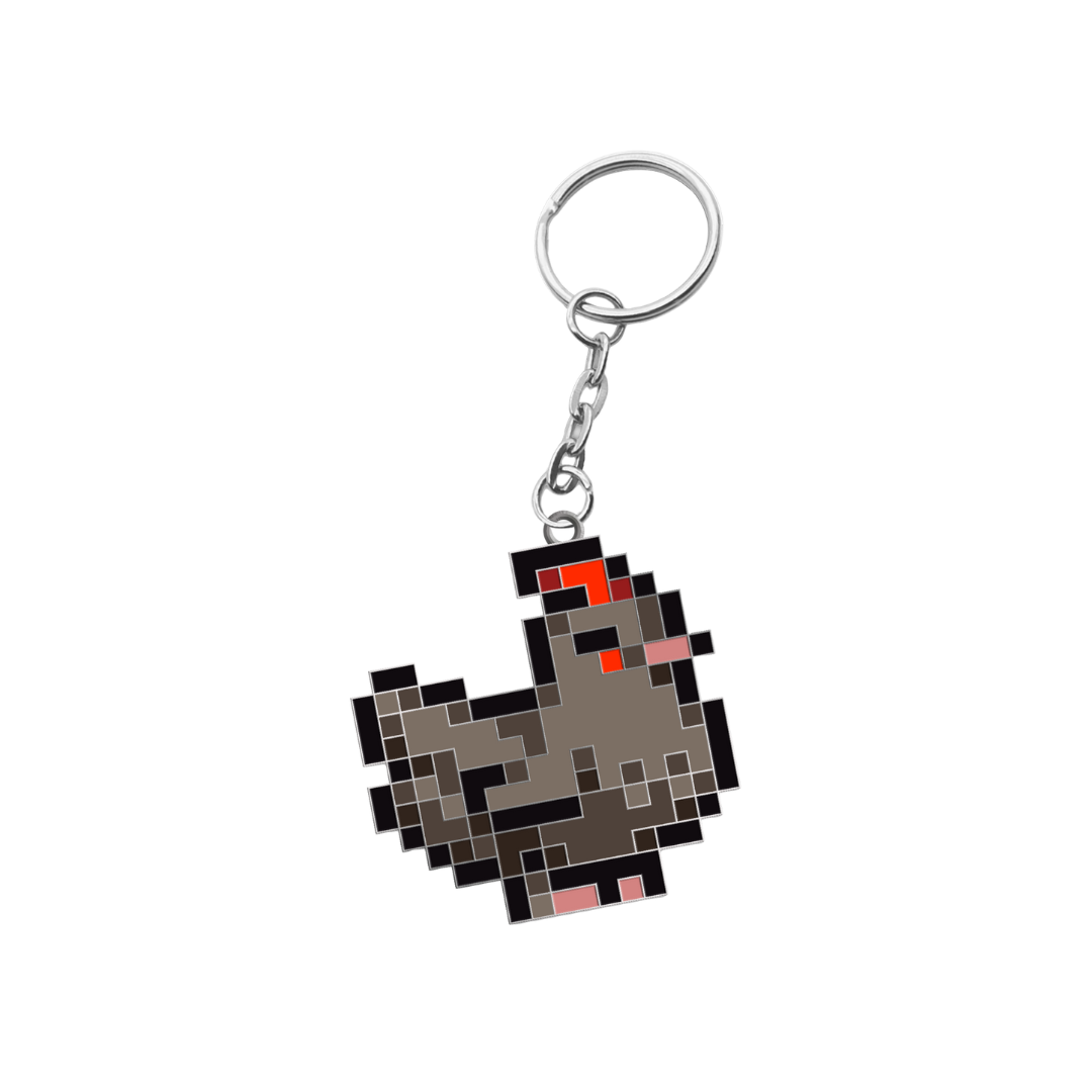 Pixelated gray chicken keychain with red accents and a silver metal ring.