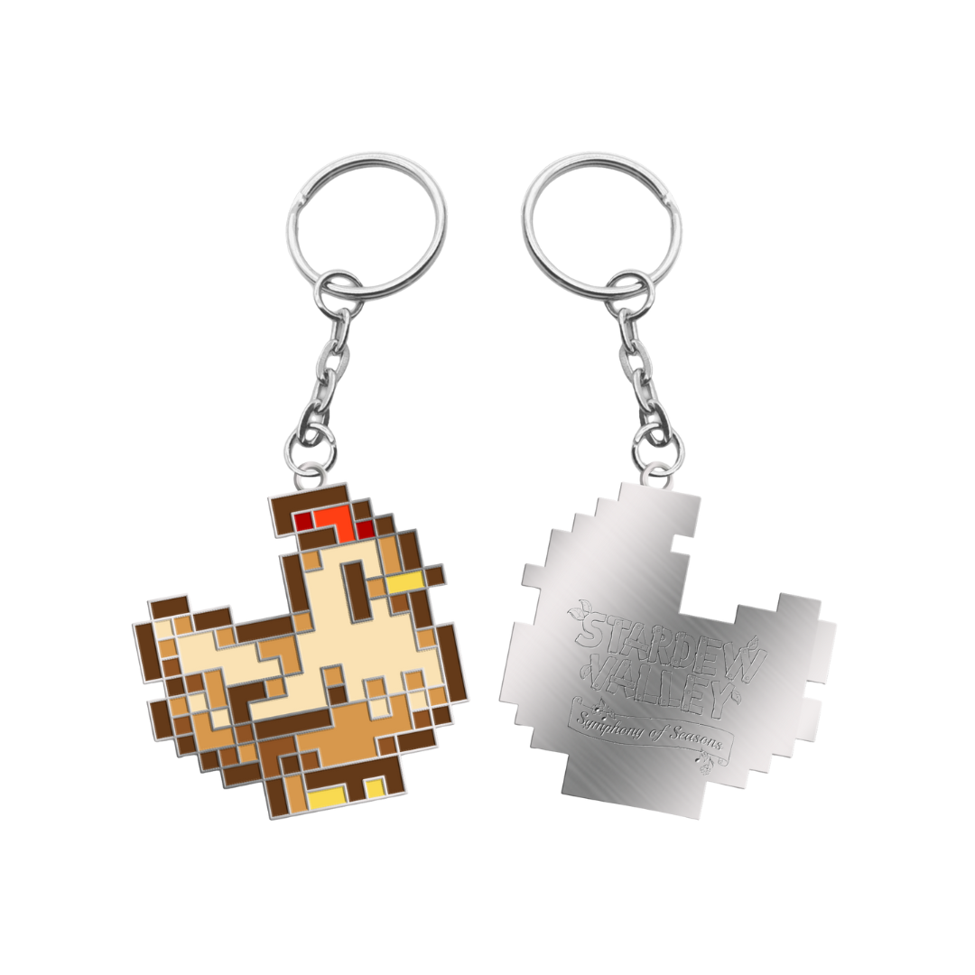 Pixelated chicken keychain with brown, beige, red and yellow enamel details on a silver metal chain.