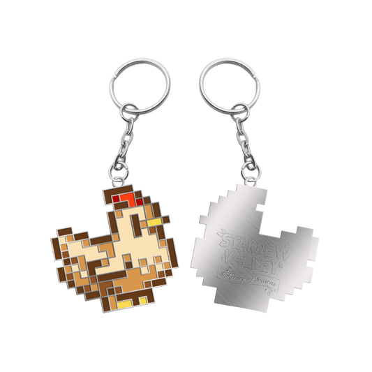 Pixelated chicken keychain with brown, beige, red and yellow enamel details on a silver metal chain.